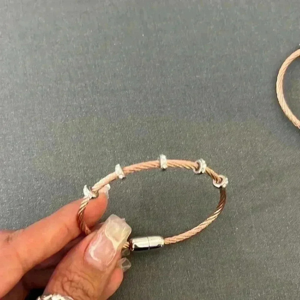 Copper in cubic zirconium Bangle bracelet with magnetic closure.